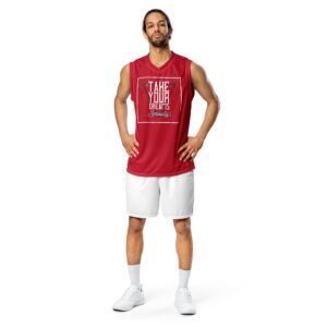  A person relaxing on a couch, wearing a comfortable Teeslo jersey tee and joggers.