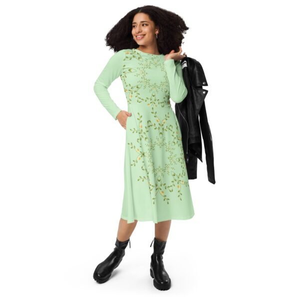 A woman smiling confidently while wearing a beautiful Teeslo dress.