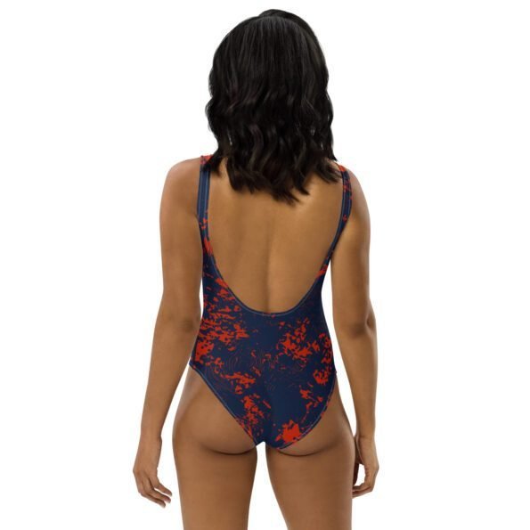 A person of any body type wearing a colorful, personalized one-piece swimsuit, smiling confidently while swimming in the ocean. Back side