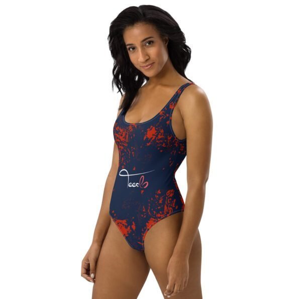 A person of any body type wearing a colorful, personalized one-piece swimsuit, smiling confidently while swimming in the ocean.