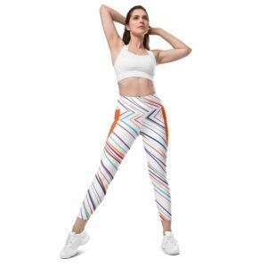 A model confidently posing in a pair of stylish Teeslo flared leggings with a cute graphic tee.
