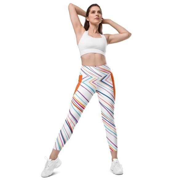A model confidently posing in a pair of stylish Teeslo flared leggings with a cute graphic tee.